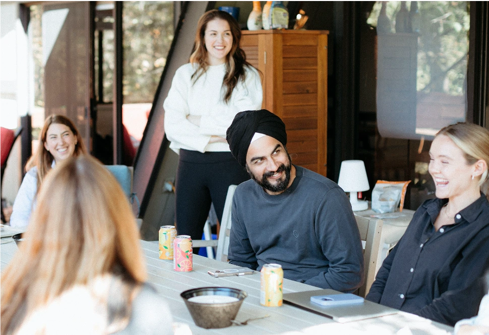 Aux team collaborating around a whiteboard in a workshop